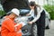 male insurance officer came to help inspect a customer\'s car that had an accident.