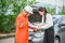 male insurance officer came to help inspect a customer\'s car that had an accident.