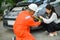 male insurance officer came to help inspect a customer\'s car that had an accident.