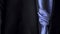 Male jacket with a purple tie, concept of business and official event. Action. Close up of stylish blue men suit with a