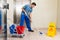 Male Janitor Mopping Floor