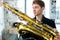 Male jazz musician playing a saxophone in a restaurant