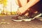 Male jogger tying his running shoes