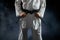 Male karateka, fighter having black belt