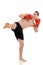 Male kick boxer kicking