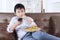 Male kid enjoy fast food at home