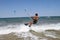 A male kite surfer rides the waves