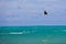 Male Kitesurfer grabing his board