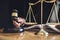 Male lawyer or judge working with contract papers, Law books and wooden gavel on table in courtroom, Justice lawyers at law firm,