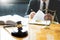 Male lawyer working with contract papers and reading law book in a courtroom, justice and law concept while presiding over trial