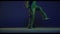 Male legs, hip-hop dancer running in place isolated over dark blue background in neon light. Modern dance art, fashion