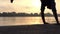 Male Legs Walk And Dance on a Riverbank at Sunset in Summer in Slo-Mo