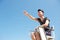 Male lifeguard smiling and pointing into the distance