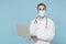 Male on-line doctor man in medical gown sterile face mask gloves isolated on blue background. Epidemic pandemic