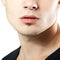 Male lips, chin and cheekbone coseup, face detail of young man