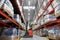 Male loader operating forklift at warehouse