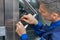 Male Lockpicker Fixing Door Handle At Home