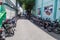 MALE, MALDIVES - JULY 11, 2016: Rows of motorcycles in an alley in Male, Maldive