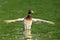 Male mallard duck spreading wings