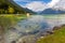 Male mallards swimming in Achensee lake in blue green shade of f