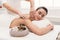 Male masseur doing professional body massage