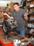 Male mechanic reconditioning modern moto