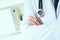 Male medical doctor posing with arms crossed, lab coat, stethoscope and hands close up, healthcare professionals concept