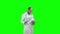 Male medicine doctor checking his papers on a Green Screen, Chroma Key.