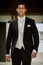 Male model on catwalk wearing bridegroom suit