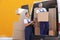 Male movers unloading boxes