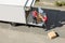 Male Movers Unloading The Cardboard Boxes Form Truck