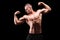 Male muscular bodybuilder posing