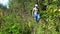 Male mushroom picker looking for mushrooms