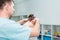 Male neurologist doctor examines cervical vertebrae of female patient spinal column in medical clinic. Neurological physical exami