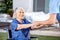 Male Nurse Helping Senior Woman To Get Up From