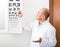 Male ophthalmologist pointing at letters