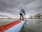 Male paddler on a racing stand up paddleboard