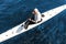 Male paddler sitting in white modern kayak