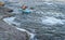 Male paddler in a whitewater kayak