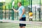 Male padel tennis player training on court