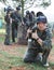 Male paintball player posing outdoors