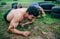 Male participant in an obstacle course crawling