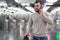 Male passenger in casual clothing near baffle gate in underground platform closeup