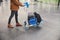 Male passenger pushing baggage cart at airport