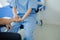 Male patient sitting in wheelchair undergoing a medical examination with specialist physician, treating injuries Getting medical