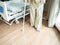 A male patient in splint walking with crutches in hospital, step forward walk with crutches for injured leg or leg splint.