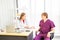 Male patients come to see a female doctor to check the illness or respiratory In the examination room