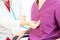 Male patients come to see a female doctor to check the illness or respiratory In the examination room