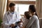 Male pediatrician examine little boy patient at consultation