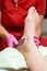 Male pedicure. Pedicurist does the procedure with male feet